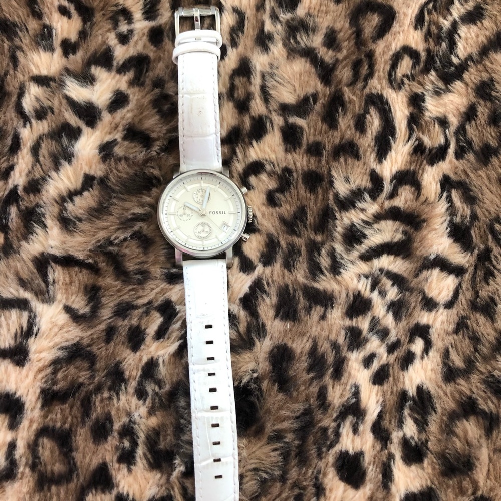 Fossil white watch with leather band.